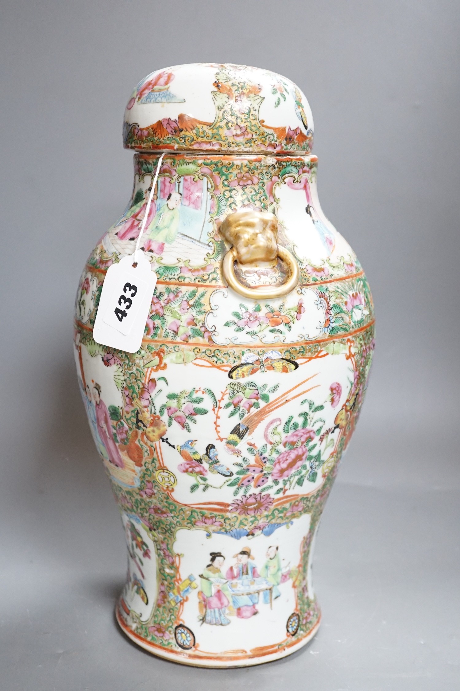 A 19th century Cantonese famille rose baluster vase and cover, the latter lacking a knop finial, 38cms high